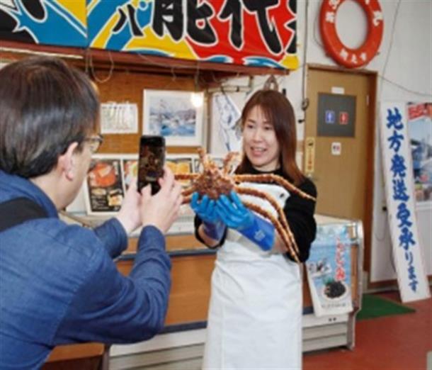カニと記念撮影